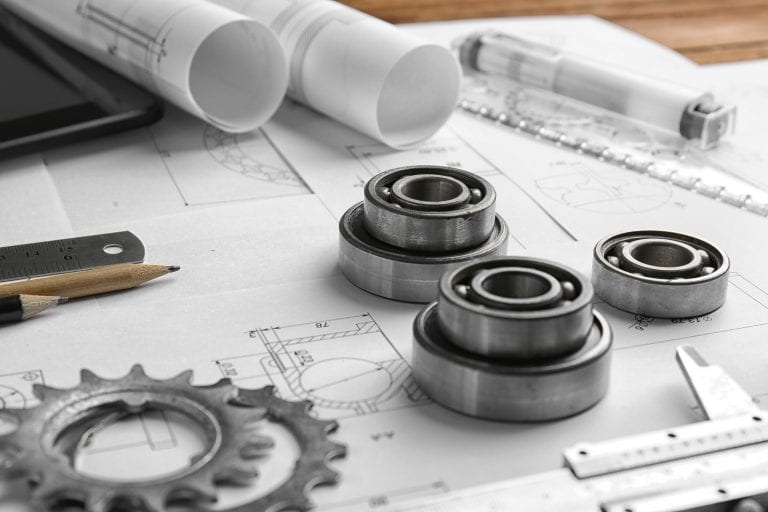 Engineering supplies and blueprints on workplace