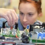 Woman working on electrical system