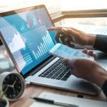 Young businessman working on laptop with diagram graph on computer.Business strategic planning.research information data concepts ideas