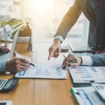 Teamwork process, business people working in the office discussing documents and ideas at meeting