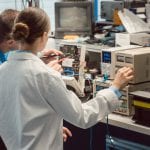 Team of electronic engineers testing a product prototype on test bench in the lab