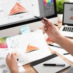 Graphic designer drawing sketches logo design. The concept of a new brand. Professional creative occupation with idea.